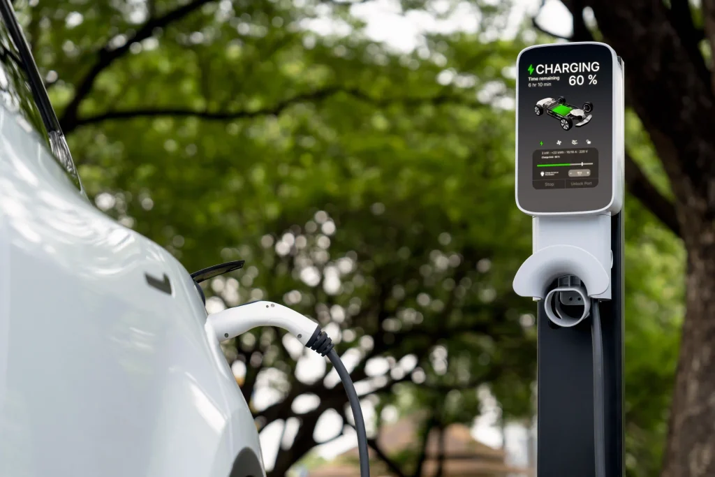 EV plugged into a powerboard or extension cord through a window | EV Charging Systems